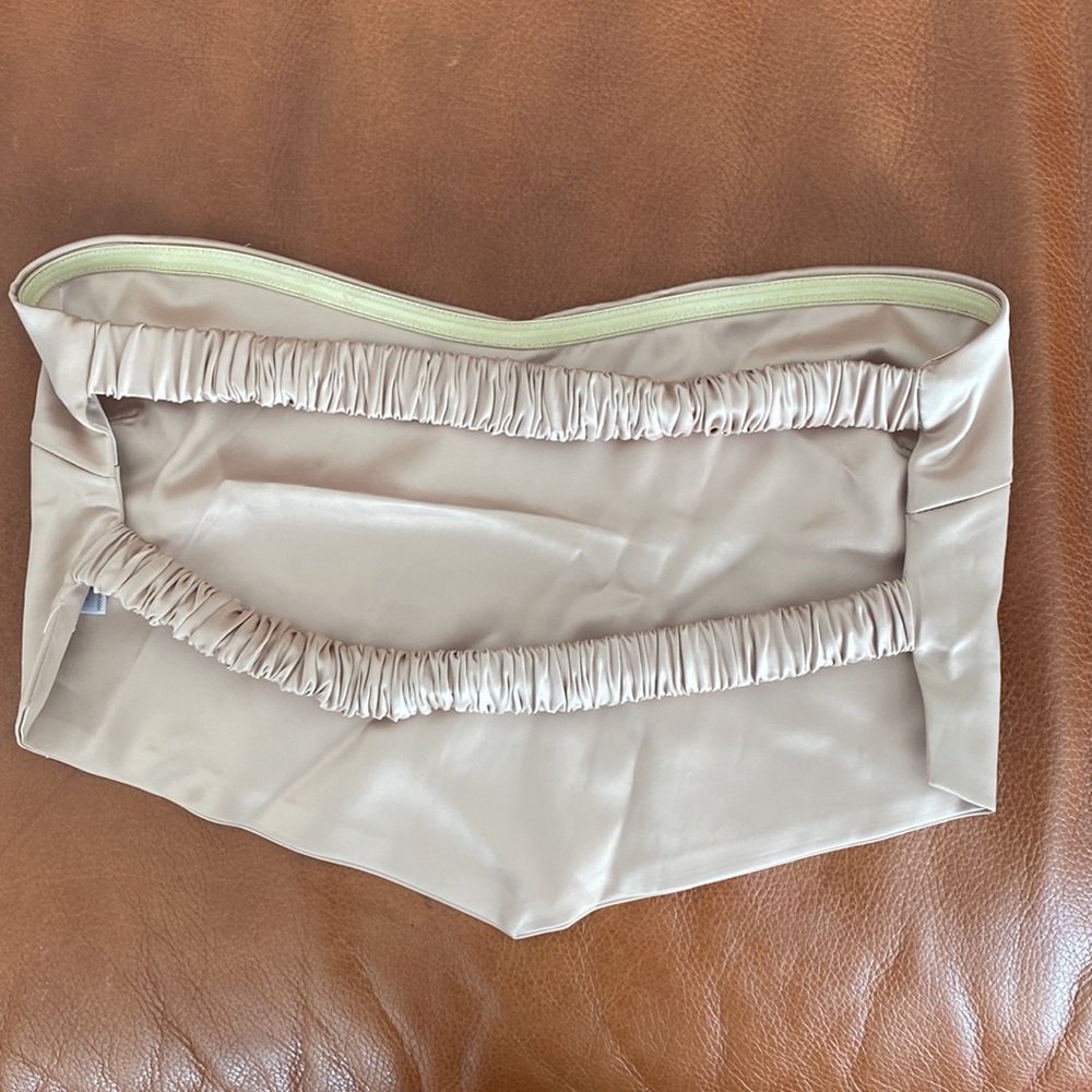 Fun gold strapless tops in a satin material